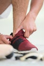sportsman tucking lace inside trainers