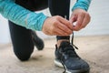 Sportsman tying shoelaces before running. Royalty Free Stock Photo