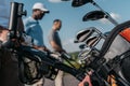 Sportsmen going to the golf course, selective focus on bag with clubs Royalty Free Stock Photo