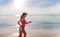 Woman running on the beach, girl doing sport outdoor, fitness and weight loss . Royalty Free Stock Photo