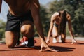 Sportspeople sprinting with a parachute and practicing outdoor training in the park.