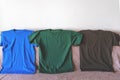 Three T-shirts of different colors. Sportswear.