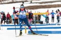 Sportswoman biathlete Yashunkina Yuliya skiing on distance biathlon complex