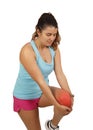 Sportswoman complaining alone suffering from knee pain after running Royalty Free Stock Photo