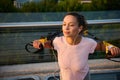 Sportswoman, determined female athlete exercising with suspension straps during a body weight workout outdoor at sunrise. Sporty Royalty Free Stock Photo