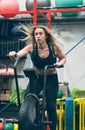 Sportswoman doing air bike at the gym Royalty Free Stock Photo