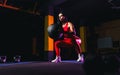 Sportswoman doing squat exercises with fitness ball. Female exer Royalty Free Stock Photo