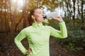 Sportswoman drinking isotonic drink