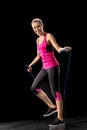 Sportswoman exercising with skipping rope