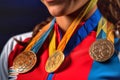 Sportswoman with gold, silver and bronze medals with ribbons Royalty Free Stock Photo