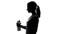 Sportswoman holding beverage, keeping water balance after workout, healthcare