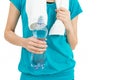 Sportswoman holding a bottle of water in her hand