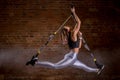 Fitness woman workout on TRX straps in gym. Crossfit style. Training TRX.