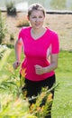 Sportswoman in pink T-shirt is training Royalty Free Stock Photo