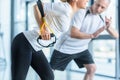 Sportswoman and senior trainer training with resistance band Royalty Free Stock Photo