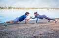 Sportswoman and sportsman giving high five to each other while d Royalty Free Stock Photo