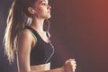 Sportswoman in tank top with earphones Royalty Free Stock Photo