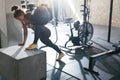 Sportswoman Training With Crossfit Ball On Box At Gym