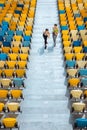 Sportswomen running on stadium stairs, running women concept