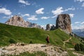 Sporty active woman climbing in Cinque Torri,Dolomites,Italy.Five towers and rock formations close to Cortina d`Ampezzo attract