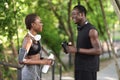 Sporty African American Couple Resting In Park After Training Outdoors Royalty Free Stock Photo