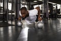 Sporty african man doing push-up in a gym. Royalty Free Stock Photo