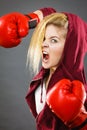 Angry woman wearing boxing gloves