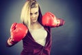 Angry woman wearing boxing gloves