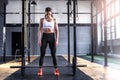 Sporty athletic woman in crossfit gym