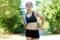 Sporty and athletic woman drinking water from a bottle after sports and workout Royalty Free Stock Photo