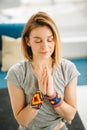 Sporty attractive woman sitting in Lotus pose