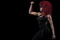 Sporty beautiful afro-american model, woman in sportwear makes fitness exercising at black background to stay fit