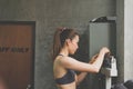 Sporty beautiful asian women standing on scale for measuring heigh Royalty Free Stock Photo