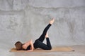 Sporty beautiful blond young woman in sportswear working out indoors, doing Eight-Limbed Posture, Ashtanga Namaskarasana on eco Royalty Free Stock Photo