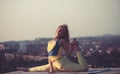 Sporty beautiful girl doing yoga in yellow sportswear under morning.