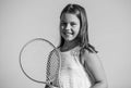 Sporty beauty. girl with tennis racquet. summer sport activity. energetic child. happy and cheerful. sporty game playing