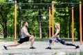 Sporty blonde girl and bearded man is warming up before training Royalty Free Stock Photo