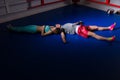 Sporty boxing couple in sportswear lying and resting after workout