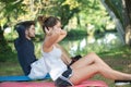 Sporty couple doing sit-ups outdoors Royalty Free Stock Photo