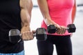 Sporty couple exercising with dumbbells i Royalty Free Stock Photo