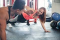 Sporty couple giving high five to each other while doing push up Royalty Free Stock Photo