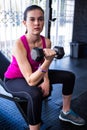 Sporty female athlete lifting dumbbell Royalty Free Stock Photo