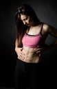 Sporty Female Holding her Stomach