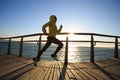 Jogger morning exercise on seaside boardwalk Royalty Free Stock Photo