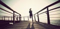 Runner running on seaside boardwalk during sunrise Royalty Free Stock Photo