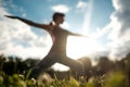 Sporty fit caucasian woman doing asana Virabhadrasana 2 Warrior pose posture in nature. Royalty Free Stock Photo