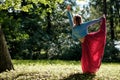 Sporty fit caucasian woman doing asana Virabhadrasana 2 Warrior pose posture in nature. Royalty Free Stock Photo