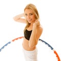 Sporty fit girl doing exercise with hula hoop. Royalty Free Stock Photo