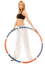 Sporty fit girl doing exercise with hula hoop. Royalty Free Stock Photo