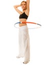 Sporty fit girl doing exercise with hula hoop. Royalty Free Stock Photo